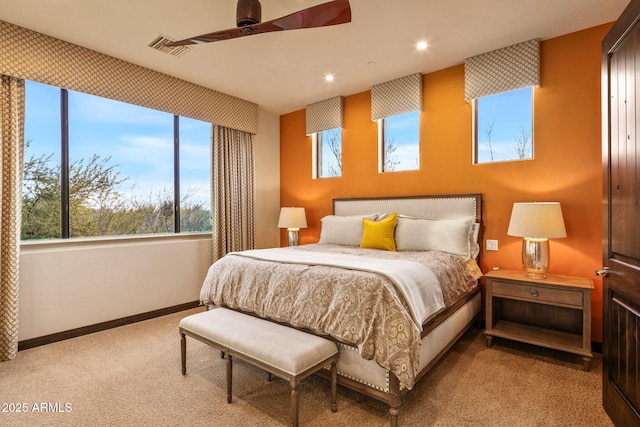 carpeted bedroom with ceiling fan