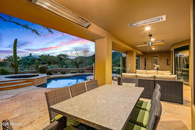 patio terrace at dusk featuring outdoor lounge area, a swimming pool with hot tub, and ceiling fan