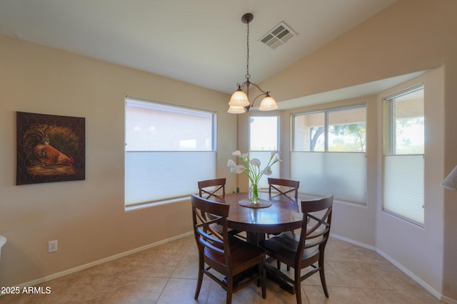 dining area with lofted ceiling, a healthy amount of sunlight, visible vents, and light tile patterned floors