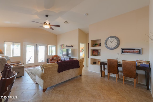 living room with visible vents, a ceiling fan, french doors, built in shelves, and light tile patterned flooring