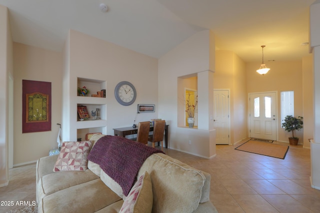 living room with baseboards, high vaulted ceiling, light tile patterned flooring, and built in features