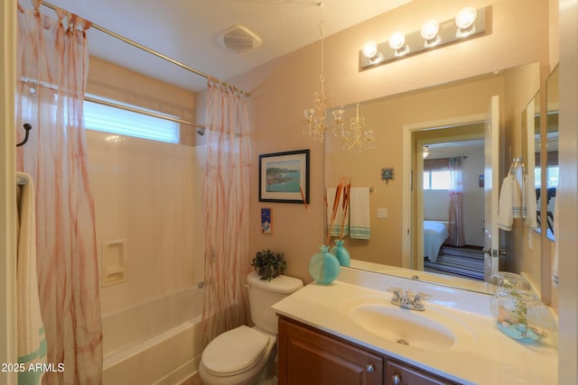 ensuite bathroom with a healthy amount of sunlight, shower / bathtub combination with curtain, toilet, and vanity