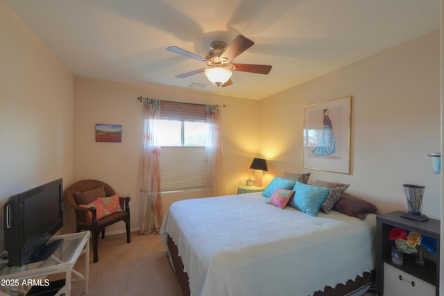 bedroom with light carpet, ceiling fan, and baseboards