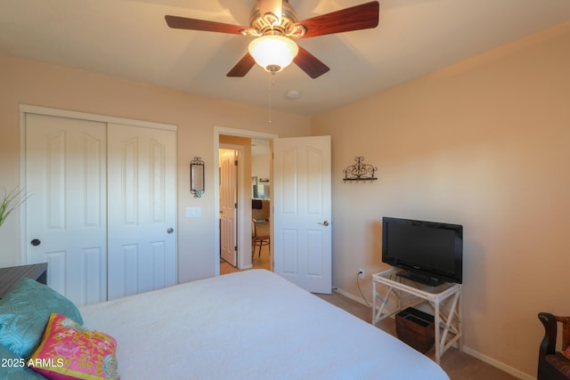 bedroom with a closet, a ceiling fan, and baseboards