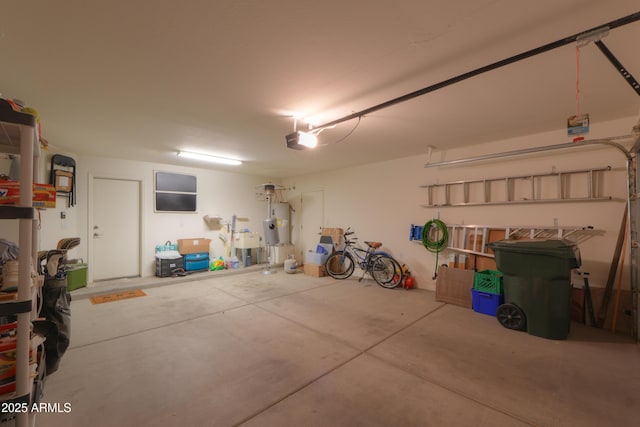 garage with water heater and a garage door opener