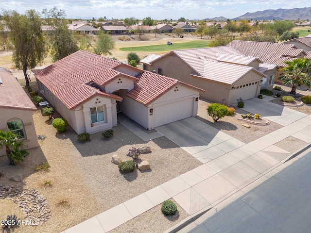 drone / aerial view with a residential view and a mountain view