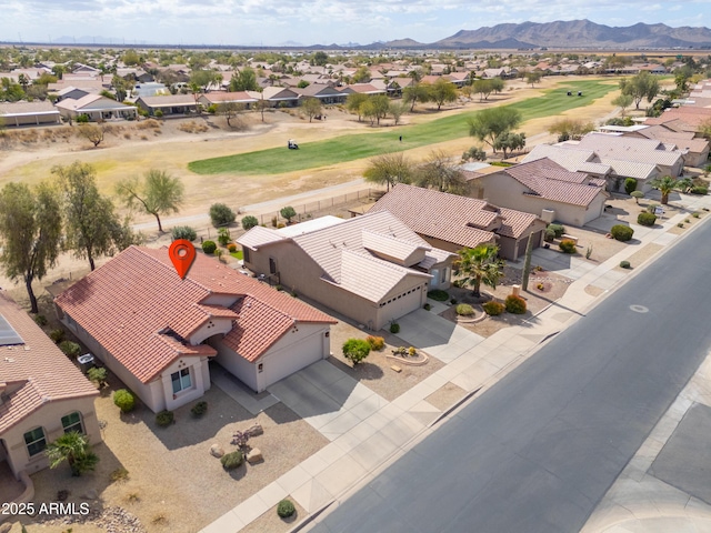 drone / aerial view featuring a residential view and a mountain view