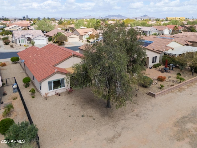 bird's eye view featuring a residential view and a mountain view