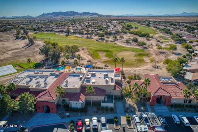 drone / aerial view featuring view of golf course and a mountain view