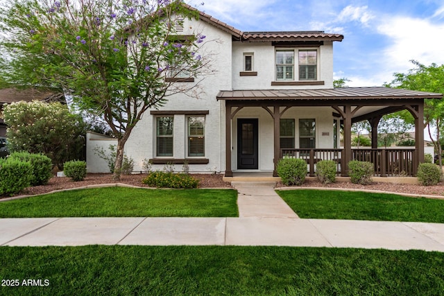 20412 W Thayer St, Buckeye, AZ 85396 - view of front of house with covered porch, a standing seam roof, stucco siding, and a front lawn