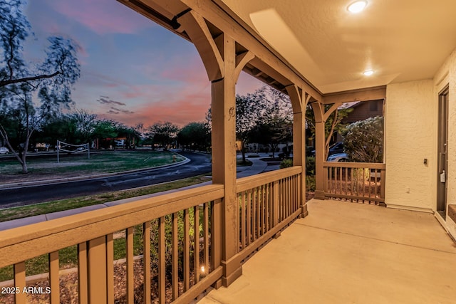 20412 W Thayer St, Buckeye, AZ 85396 - patio terrace at dusk featuring covered porch