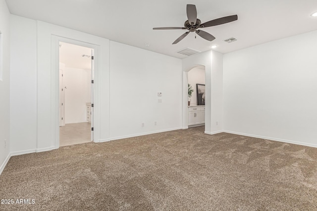 20412 W Thayer St, Buckeye, AZ 85396 - carpeted spare room with ceiling fan, arched walkways, recessed lighting, and baseboards