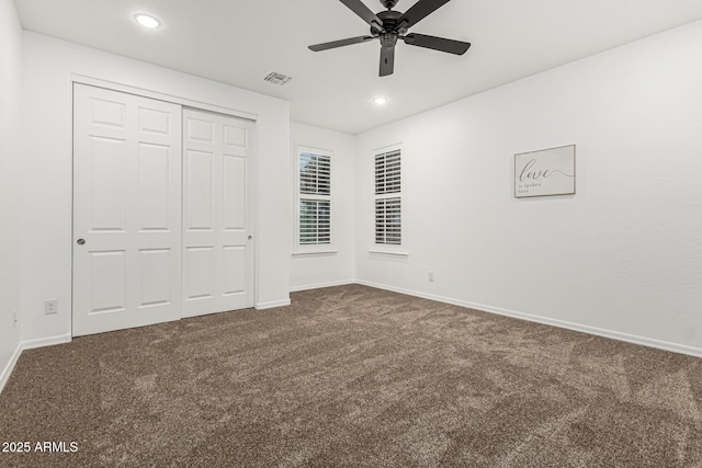 20412 W Thayer St, Buckeye, AZ 85396 - unfurnished bedroom featuring dark colored carpet, baseboards, recessed lighting, a closet, and a ceiling fan