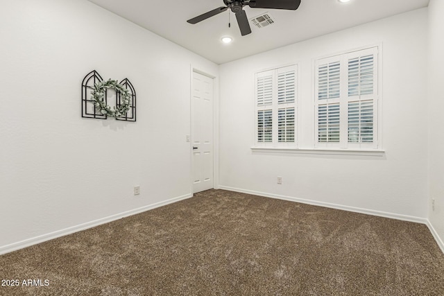 20412 W Thayer St, Buckeye, AZ 85396 - spare room featuring dark carpet, a ceiling fan, baseboards, and recessed lighting