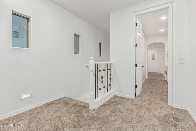 20412 W Thayer St, Buckeye, AZ 85396 - hallway with carpet, arched walkways, and baseboards