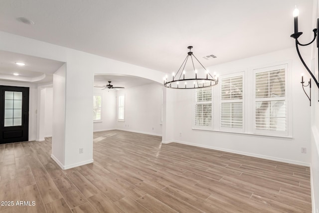 20412 W Thayer St, Buckeye, AZ 85396 - unfurnished dining area featuring a chandelier, light wood-style floors, baseboards, and ceiling fan