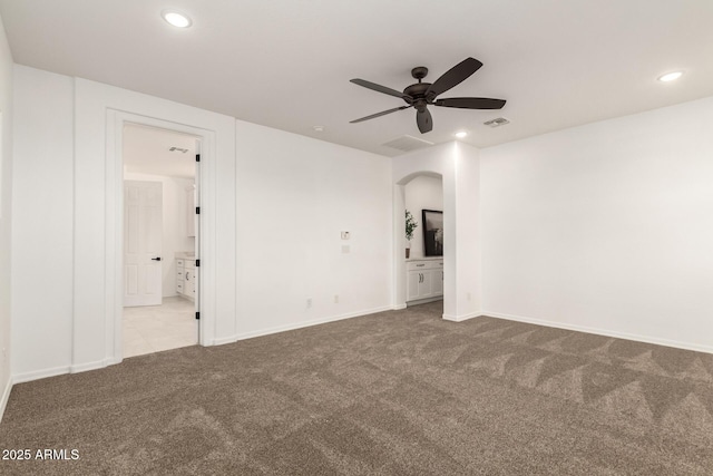 20412 W Thayer St, Buckeye, AZ 85396 - carpeted spare room with ceiling fan, recessed lighting, arched walkways, and baseboards