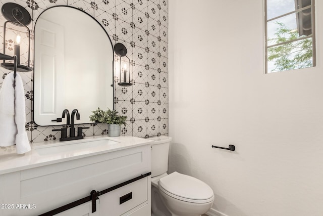 20412 W Thayer St, Buckeye, AZ 85396 - bathroom with vanity, toilet, and tasteful backsplash