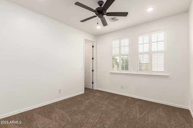20412 W Thayer St, Buckeye, AZ 85396 - empty room with dark carpet, baseboards, a ceiling fan, and recessed lighting