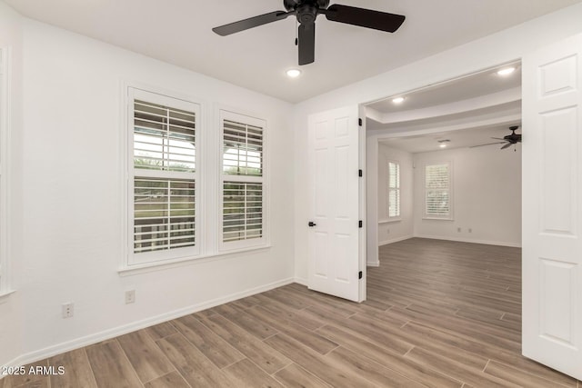20412 W Thayer St, Buckeye, AZ 85396 - unfurnished room with a ceiling fan, healthy amount of natural light, light wood-type flooring, baseboards, and recessed lighting