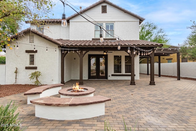 20412 W Thayer St, Buckeye, AZ 85396 - back of house with french doors, a fire pit, stucco siding, a tiled roof, and a patio area