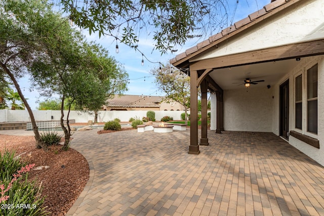 20412 W Thayer St, Buckeye, AZ 85396 - fenced backyard featuring a ceiling fan, a patio area, and a fire pit