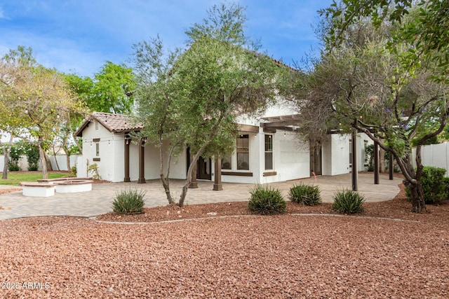 20412 W Thayer St, Buckeye, AZ 85396 - view of front of property with a patio and stucco siding