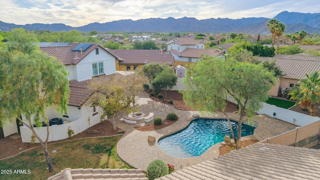 20412 W Thayer St, Buckeye, AZ 85396 - view of swimming pool with a fenced backyard, a residential view, a patio, and a mountain view