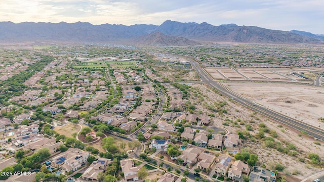 20412 W Thayer St, Buckeye, AZ 85396 - aerial view of property and surrounding area featuring mountains and nearby suburban area