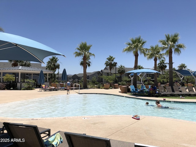 20412 W Thayer St, Buckeye, AZ 85396 - community pool with a patio area