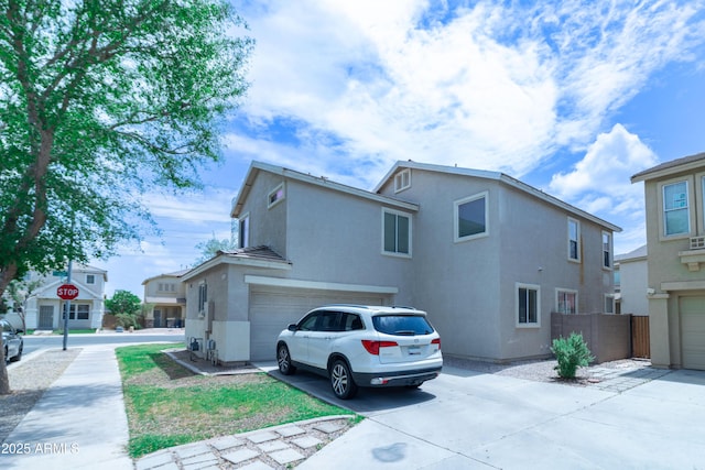 12161 W Flanagan St, Avondale, AZ 85323 - view of front of property with stucco siding, an attached garage, and concrete driveway