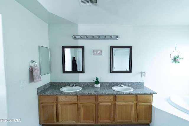 12161 W Flanagan St, Avondale, AZ 85323 - full bathroom with double vanity and a bath