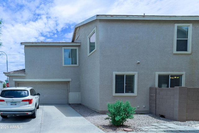 12161 W Flanagan St, Avondale, AZ 85323 - view of side of property featuring stucco siding, driveway, and a garage