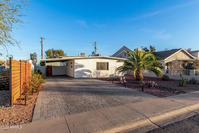 ranch-style house with a carport