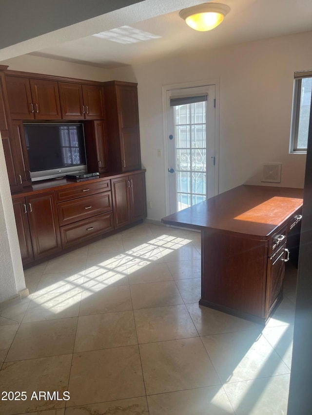 1059 E Broadmor Dr, Tempe, AZ 85282 - kitchen with plenty of natural light, light tile patterned floors, and dark countertops