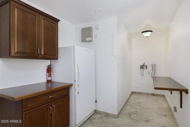 1059 E Broadmor Dr, Tempe, AZ 85282 - kitchen with freestanding refrigerator, baseboards, and dark countertops