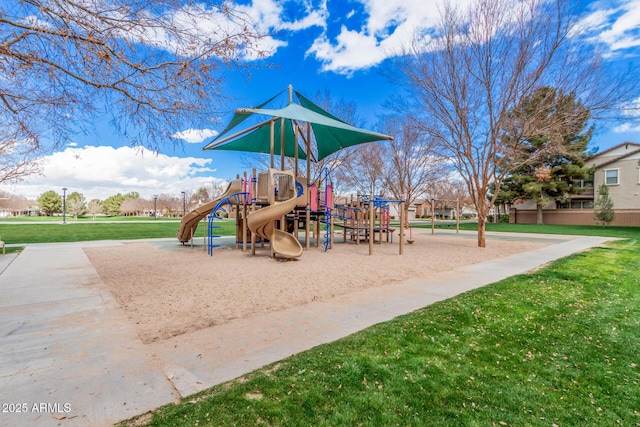 community jungle gym with a yard