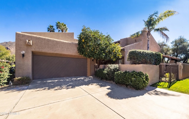 southwest-style home featuring a garage