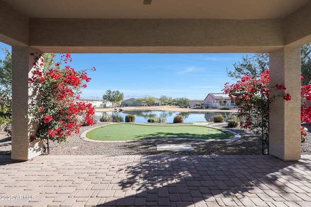 view of patio with a water view