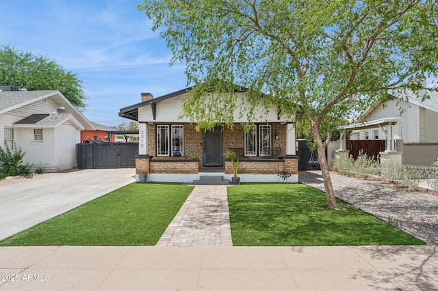 2310 N 11th St, Phoenix, AZ 85006 - view of front of property featuring brick siding, covered porch, a chimney, and concrete driveway