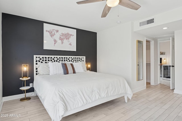 2310 N 11th St, Phoenix, AZ 85006 - bedroom featuring wood finished floors, baseboards, and ceiling fan