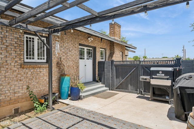 2310 N 11th St, Phoenix, AZ 85006 - view of patio / terrace with entry steps, a gate, and a grill