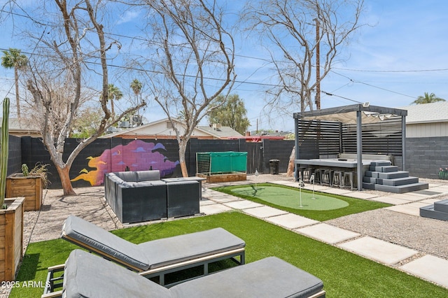 2310 N 11th St, Phoenix, AZ 85006 - fenced backyard with a putting area, an outdoor hangout area, and a patio area