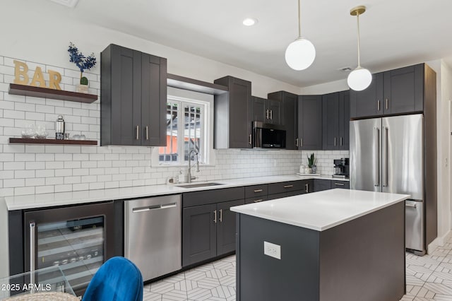 2310 N 11th St, Phoenix, AZ 85006 - kitchen with appliances with stainless steel finishes, a sink, beverage cooler, light countertops, and decorative backsplash