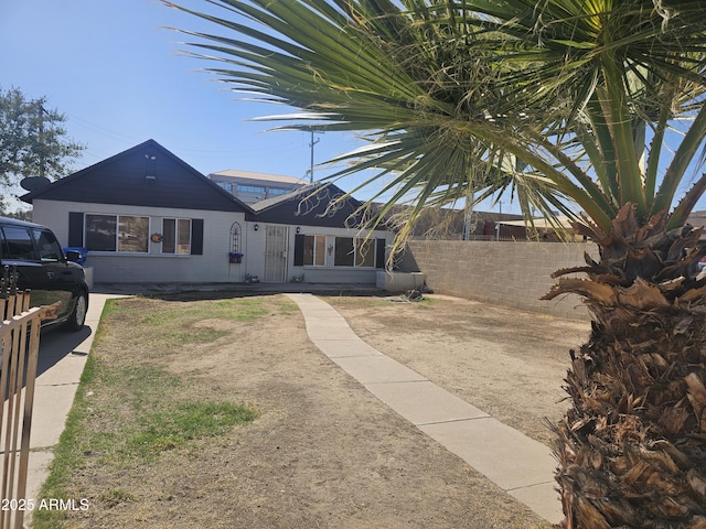 view of front of house with fence