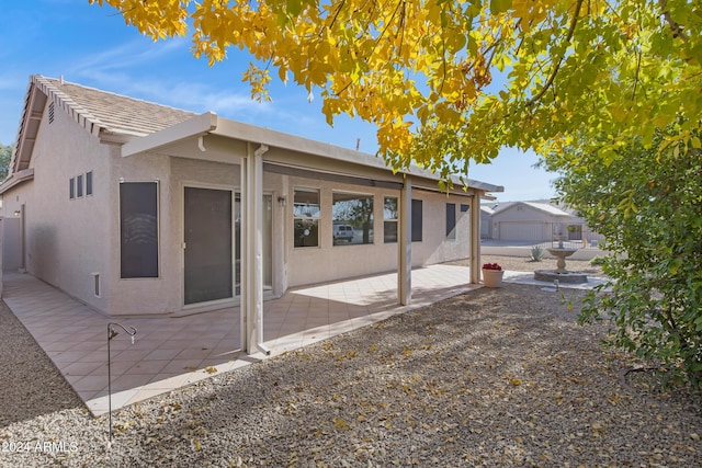 view of side of property with a patio area