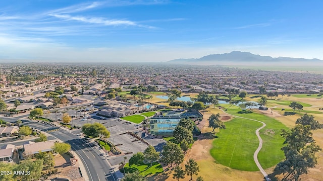 birds eye view of property with a water and mountain view