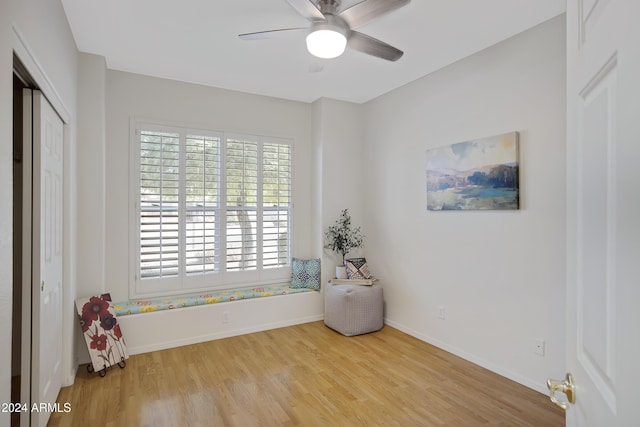 interior space featuring ceiling fan and light wood-type flooring