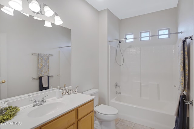 full bathroom featuring tile patterned floors, toilet, vanity, and washtub / shower combination