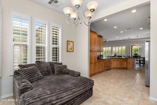 living room featuring a chandelier, recessed lighting, light tile patterned floors, and baseboards